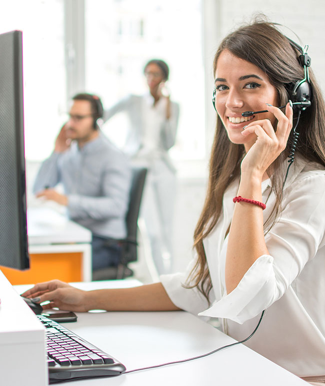 Image of a phone operator, smiling towards the viewer, representing contacting Accountivity with Mier